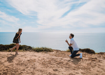 San Diego Couples Session suddenly turned up when he hit his knees. The Surprise Engagement Proposal was Photographer by local San Diego Photographer, Brandon Colbert Photography at Cabrillo National Monument.