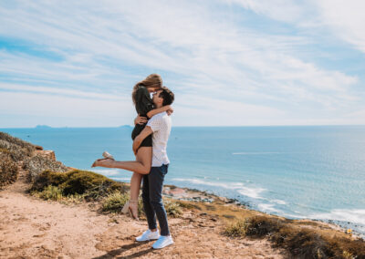 San Diego Couples Session suddenly turned up when he hit his knees. The Surprise Engagement Proposal was Photographer by local San Diego Photographer, Brandon Colbert Photography at Cabrillo National Monument.