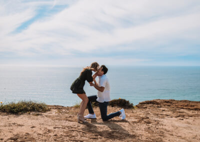 San Diego Couples Session suddenly turned up when he hit his knees. The Surprise Engagement Proposal was Photographer by local San Diego Photographer, Brandon Colbert Photography at Cabrillo National Monument.