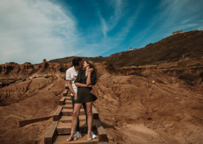 San Diego Couples Session suddenly turned up when he hit his knees. The Surprise Engagement Proposal was Photographer by local San Diego Photographer, Brandon Colbert Photography at Cabrillo National Monument.