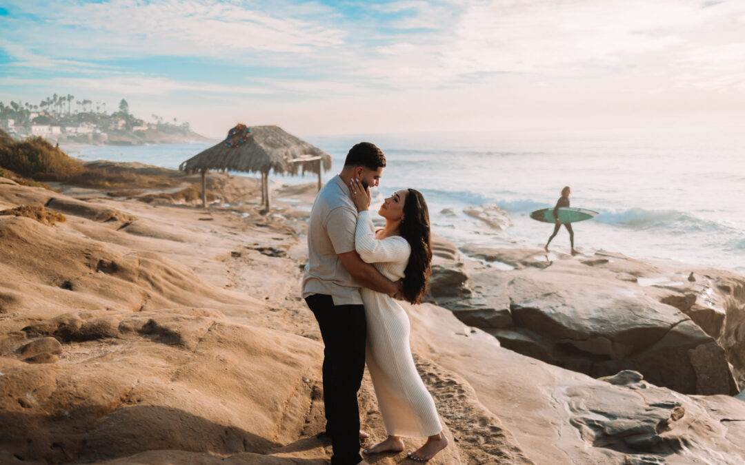 Local La Jolla, California Photographer, Brandon Colbert Photography navigating the reefs with grace on the beautiful couples Engagement Session on the beach in La Jolla, California 2024.